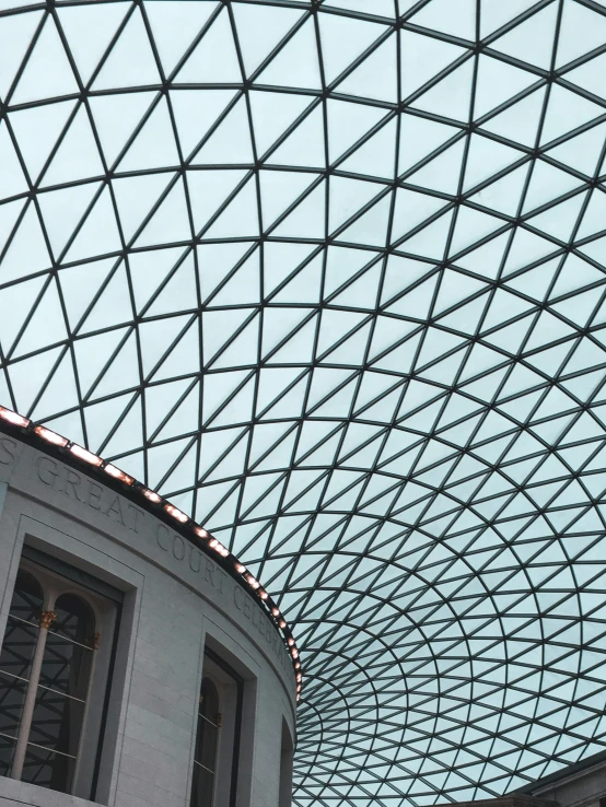 a dome ceiling in a building with a clock