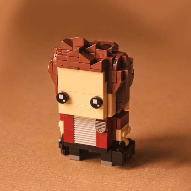 a lego figure in red and brown standing