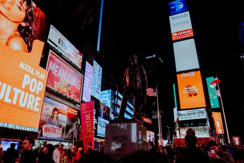 many billboards of different kinds on the sides of buildings