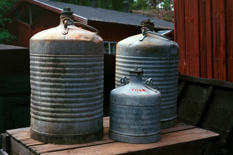 two tin containers stacked on top of each other