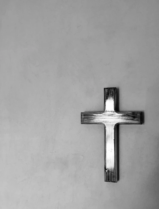 a cross with a black and white po of it