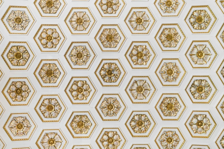 there are many decorative gold hexagonal shapes