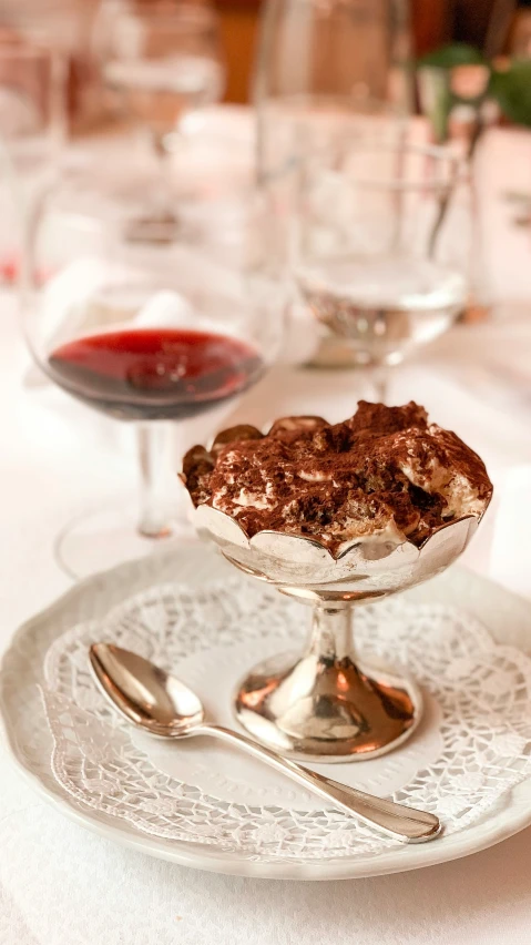 there are a bunch of desserts and silver ware on this table