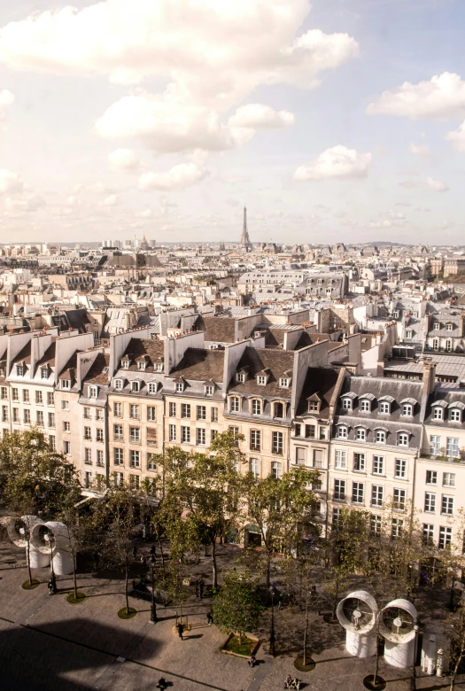 view of rooftops, buildings and street from arc de trioe du montmart