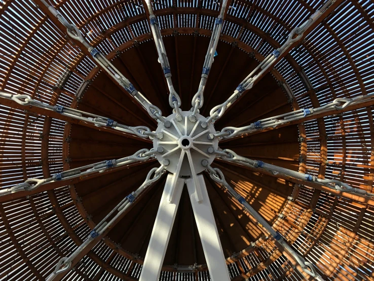 the inside of a large metal structure looking up