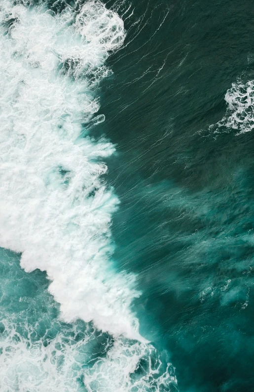 a person is riding a surf board on a large wave