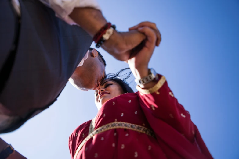 a person fixing another mans hand in an image