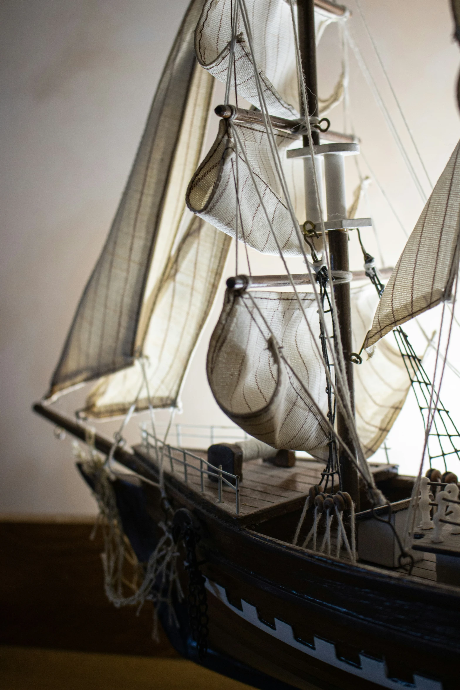 a wooden model sail ship with sails and sails
