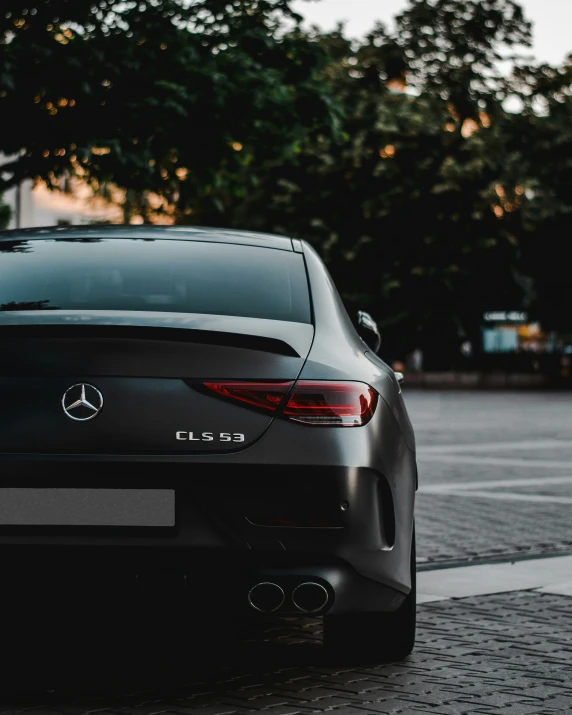 the back end of a car parked on the street