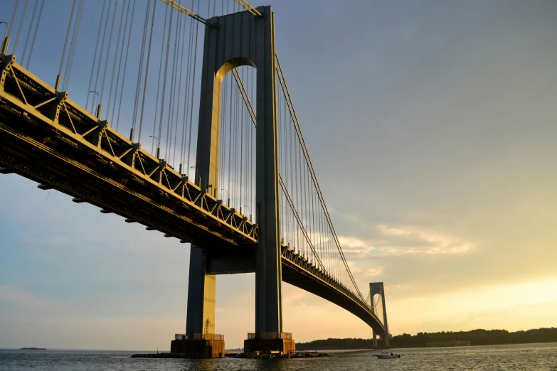 a large bridge is shown from the water