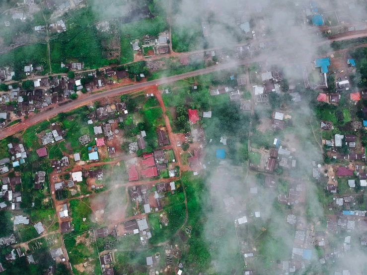 the sky is full of clouds and small houses