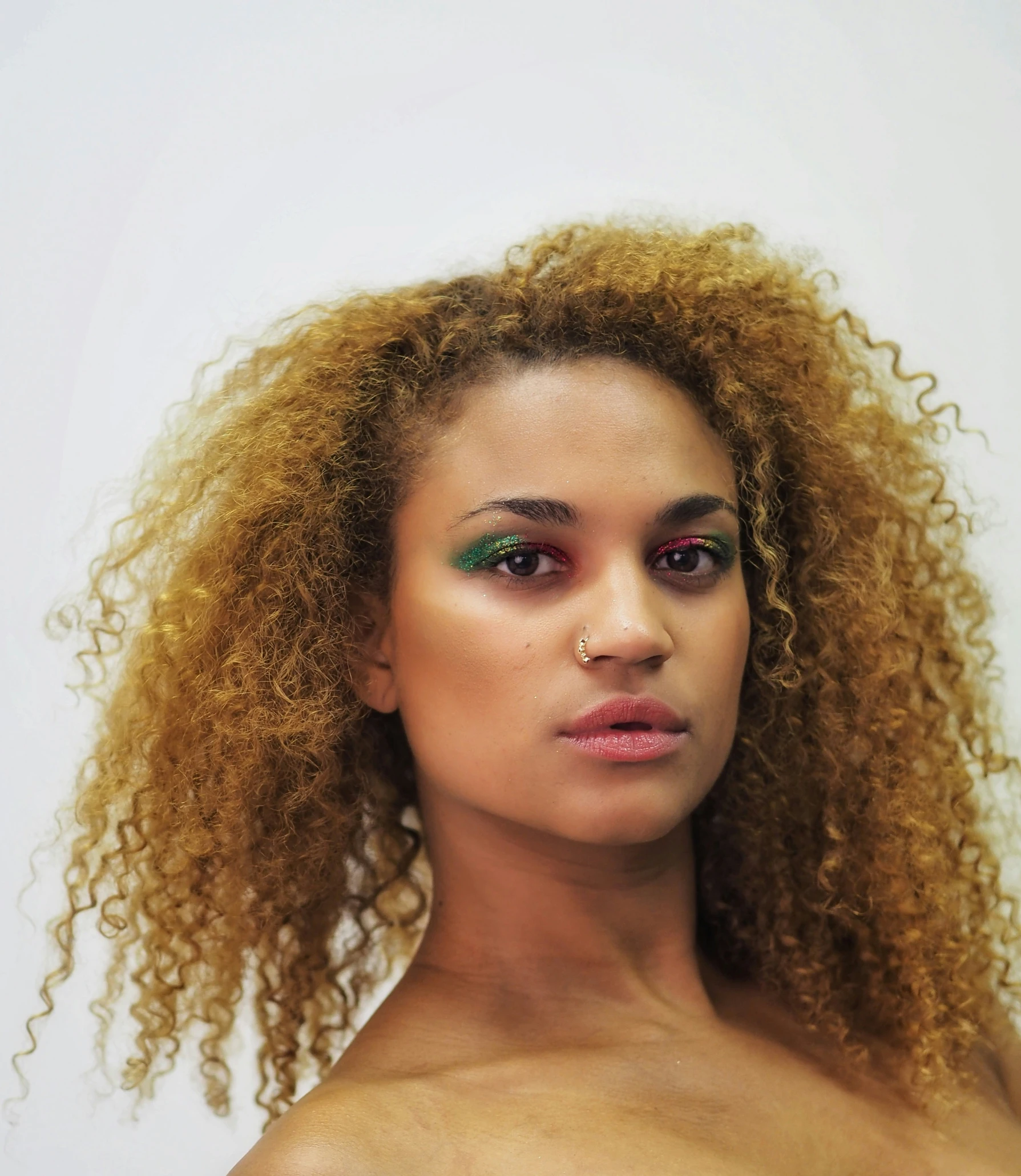 a beautiful young lady with long, curly hair