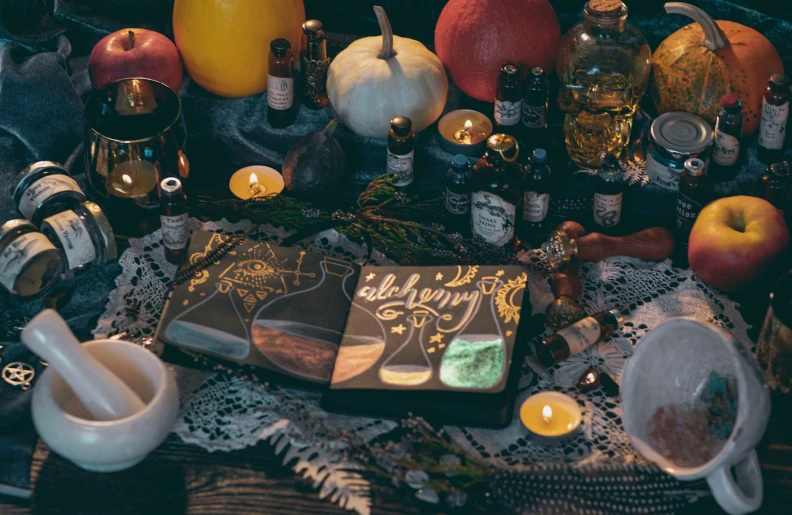 a table topped with cakes and candles covered in frosting