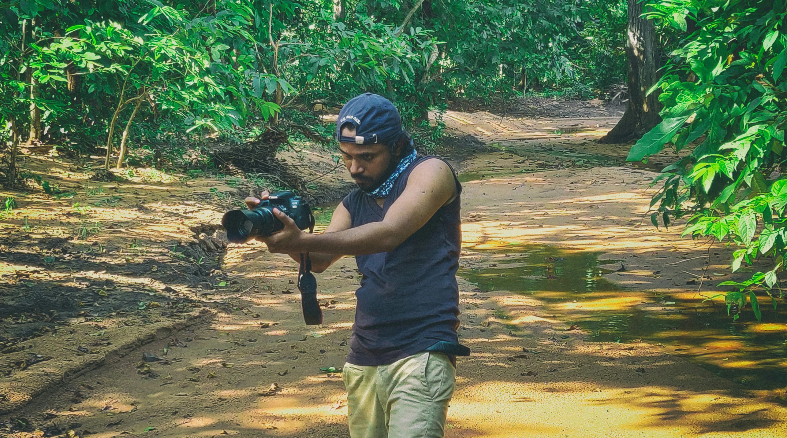 a man holding an object and a camera