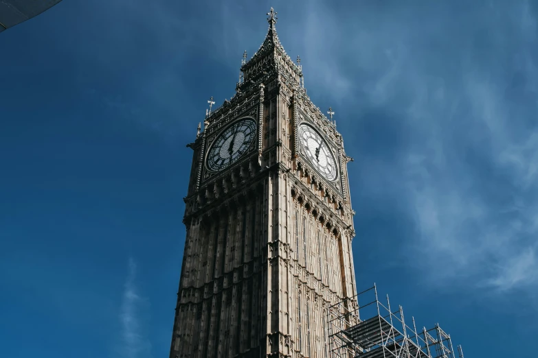 this is a large clock on the side of a tower