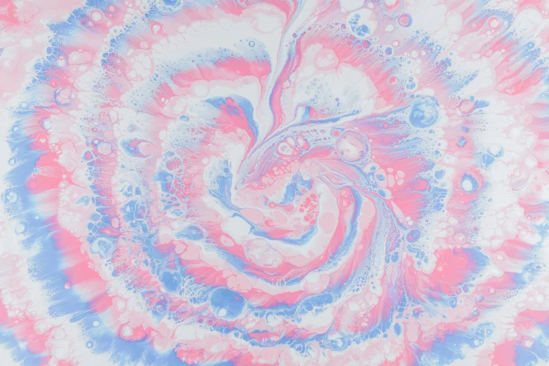 blue and pink swirling paper with a light red center