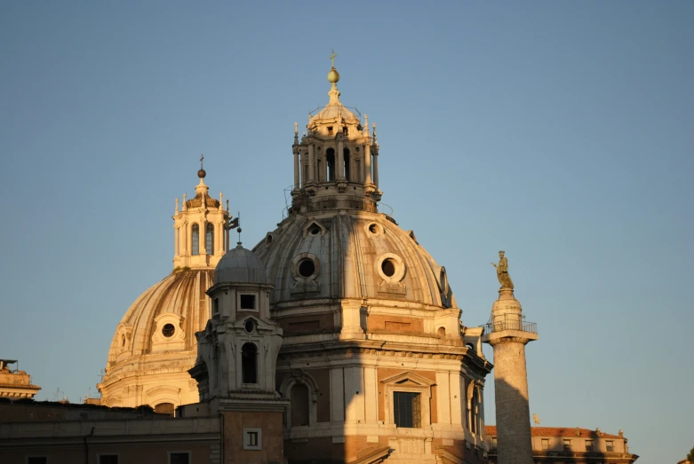 the top of a very tall building with domed towers