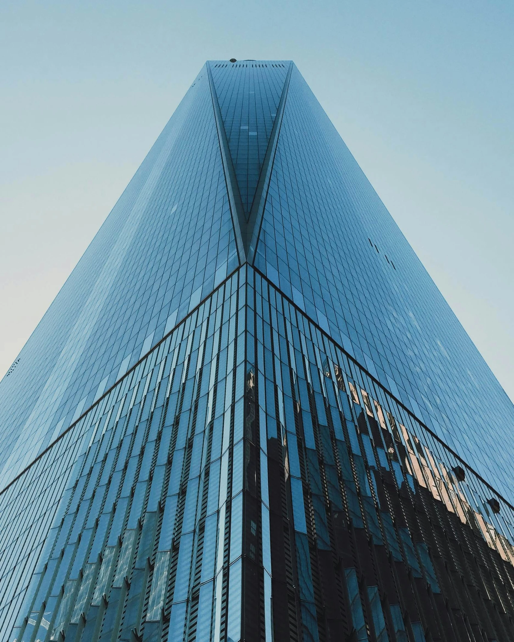 tall building in front of blue sky and cloud