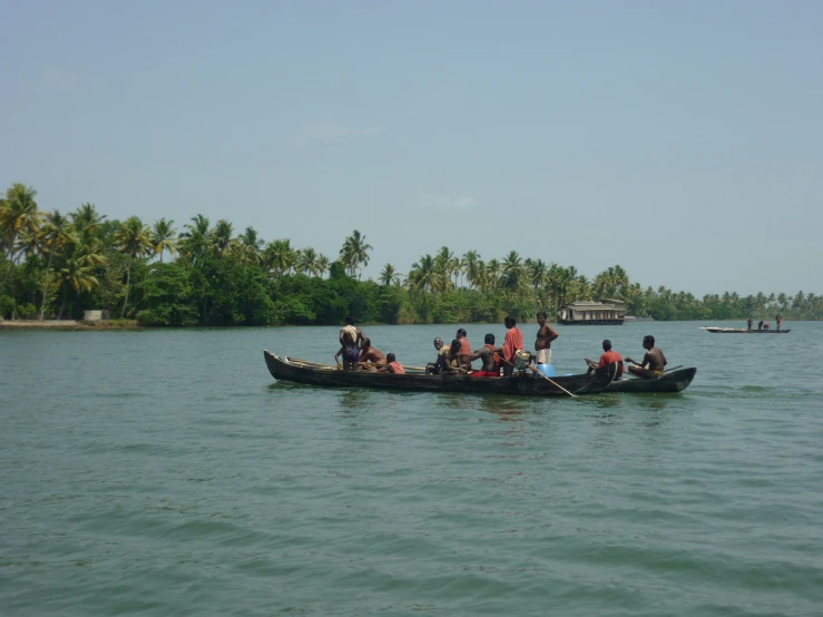 several people in a canoe on a calm lake