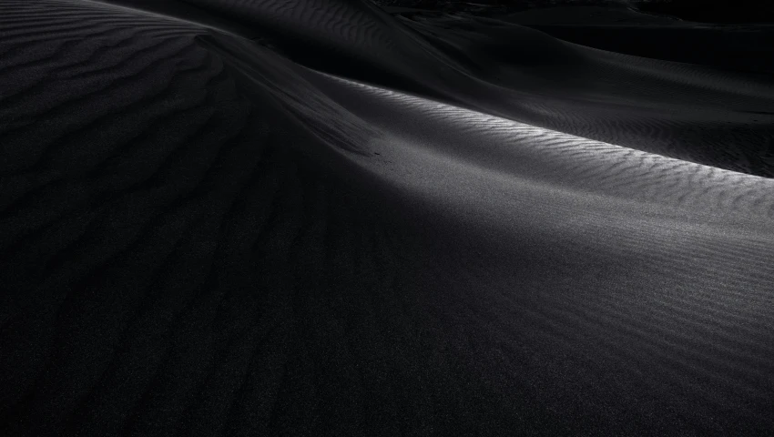 shadows form on sand at a desert landscape