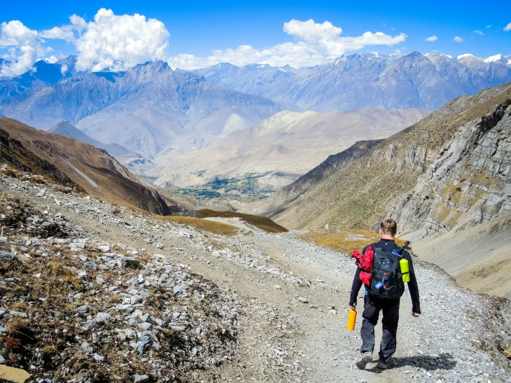 the hiker is heading towards the summit