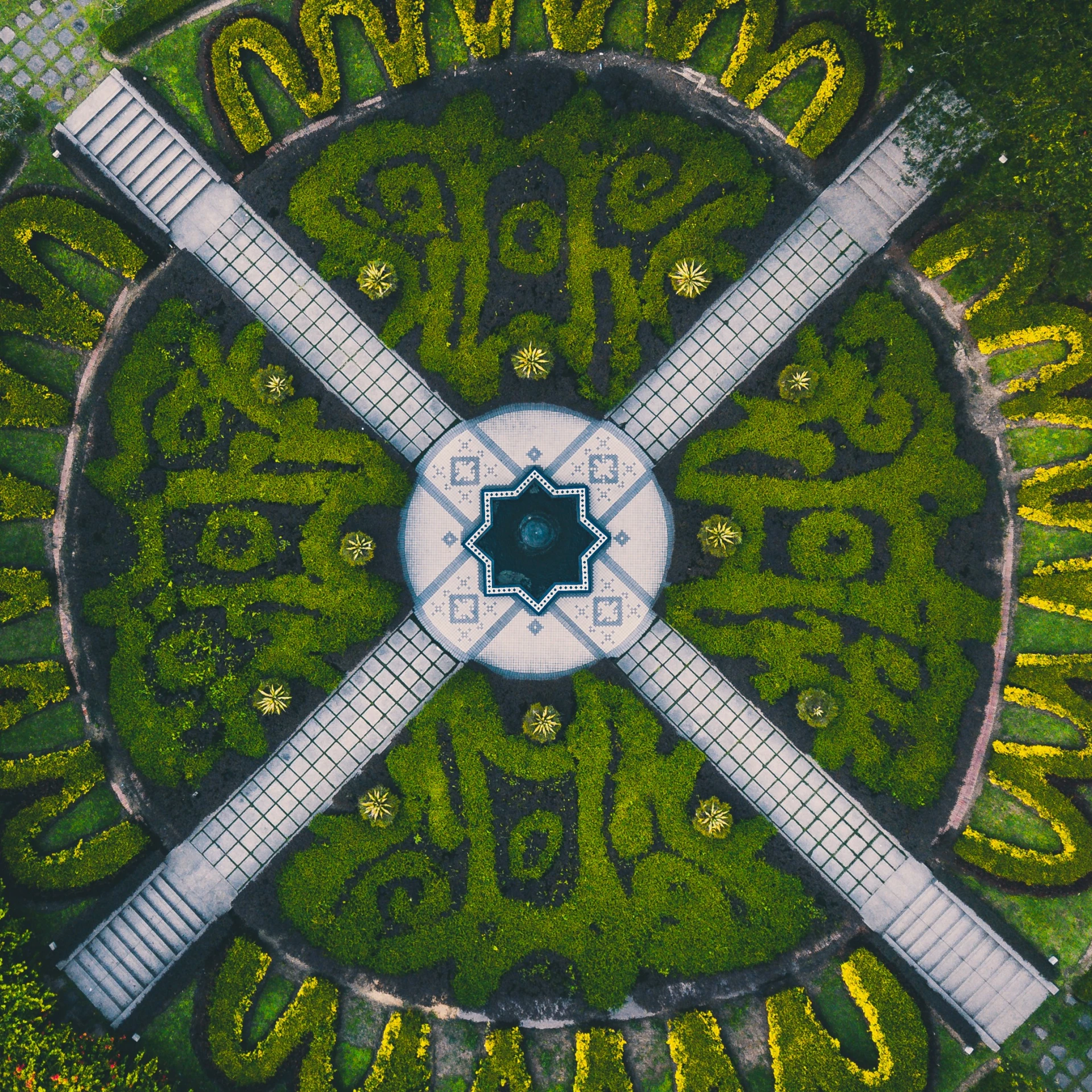 aerial s of the circular garden with a guitar in the center