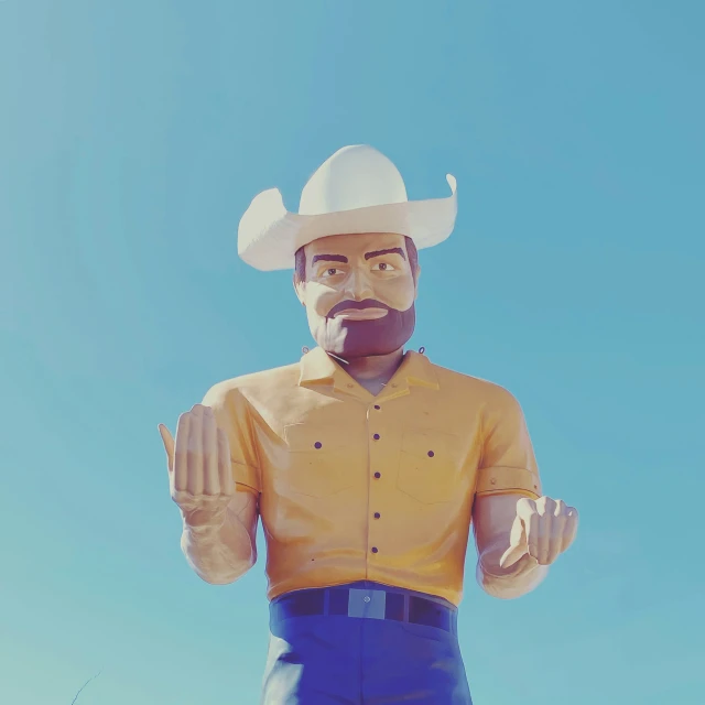a sculpture of a man wearing a cowboy hat