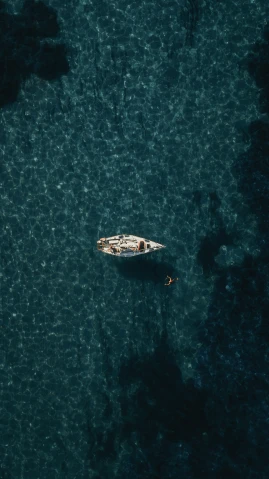 a boat floats close to the ocean surface