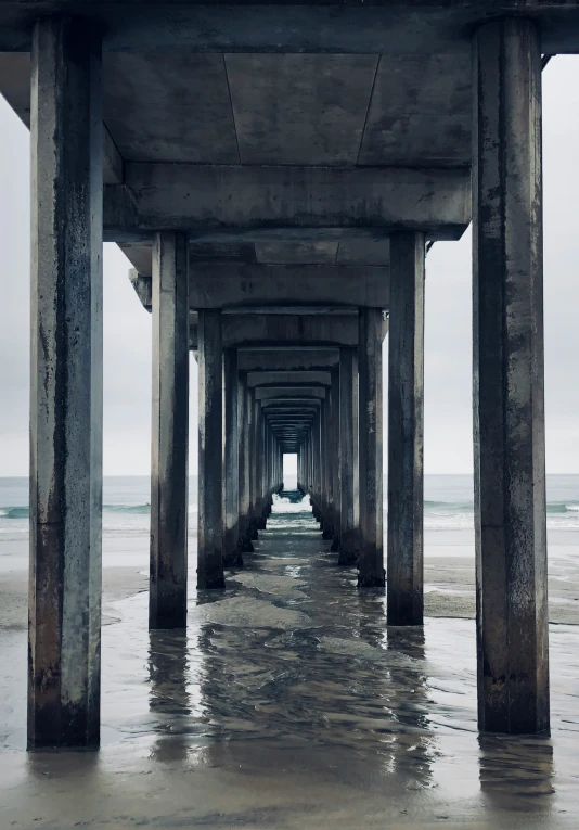 a view looking down at a pier from the water