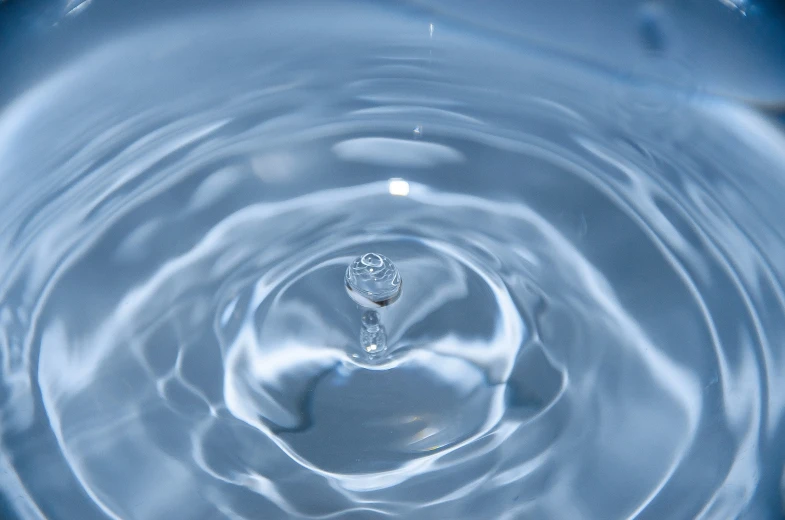 an up close view of some water with blue and white