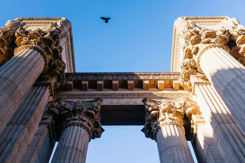 two tall pillars in the middle of a blue sky