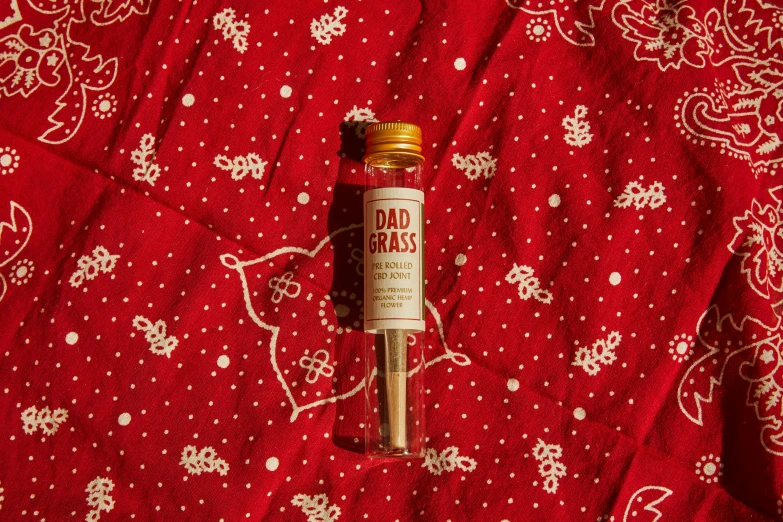 a bottle of old world bars on a red blanket