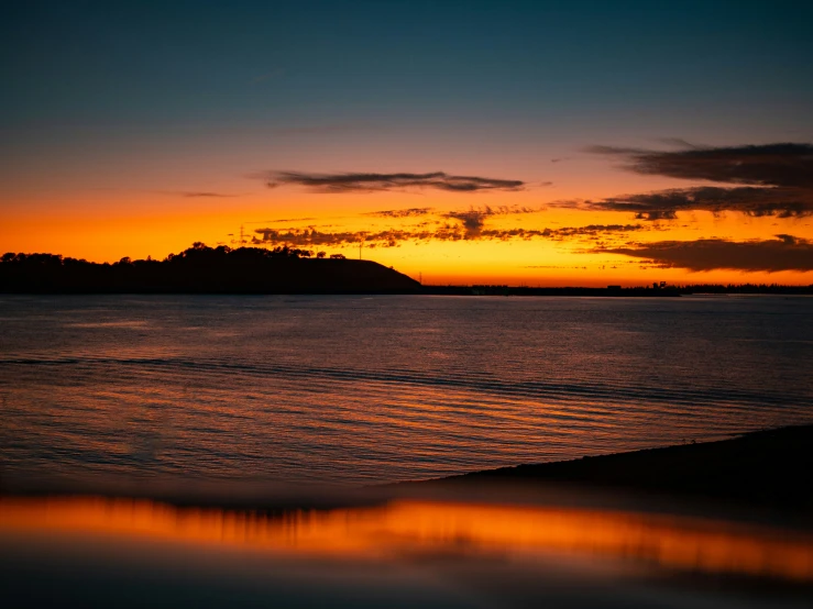 a view of a sunset over the water