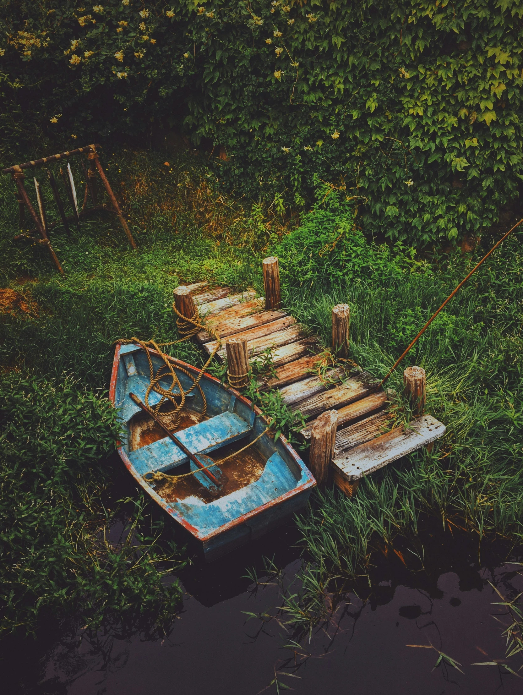 a little boat sitting in a body of water