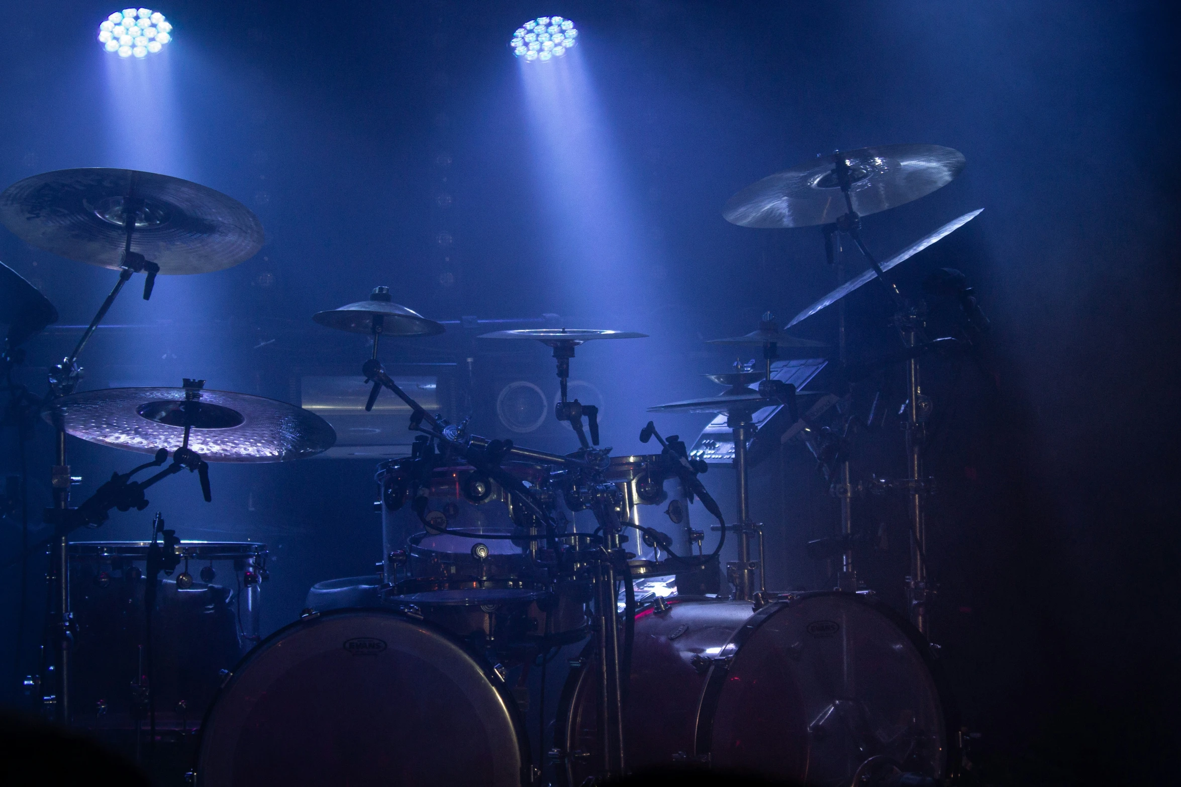 two drums, four cyoniclers and drums in dark room