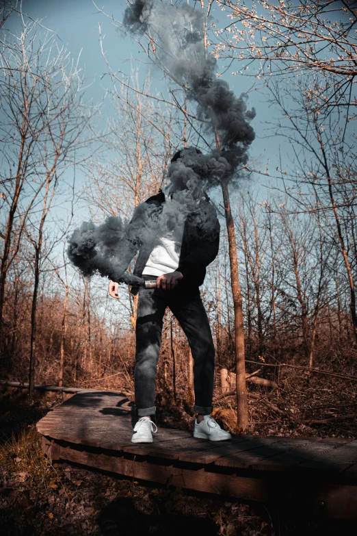 a smokey man stands on a platform