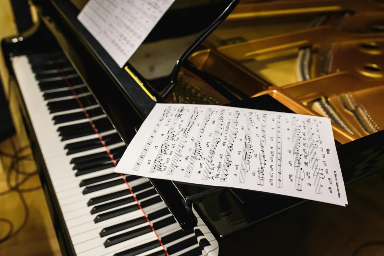 a sheet that is sitting on top of a piano