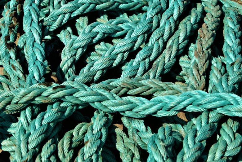 some very bright green ropes are arranged in a formation