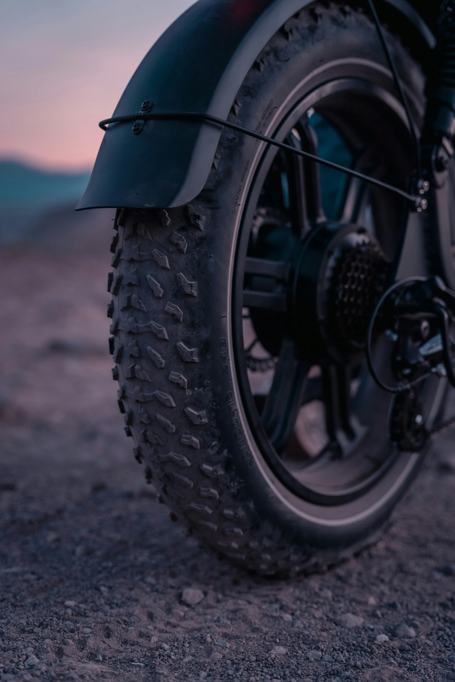 a close up view of a motorcycle tire and chain