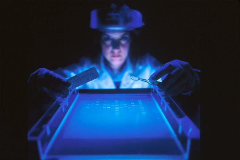 a man wearing glasses and safety gear making an interactive display