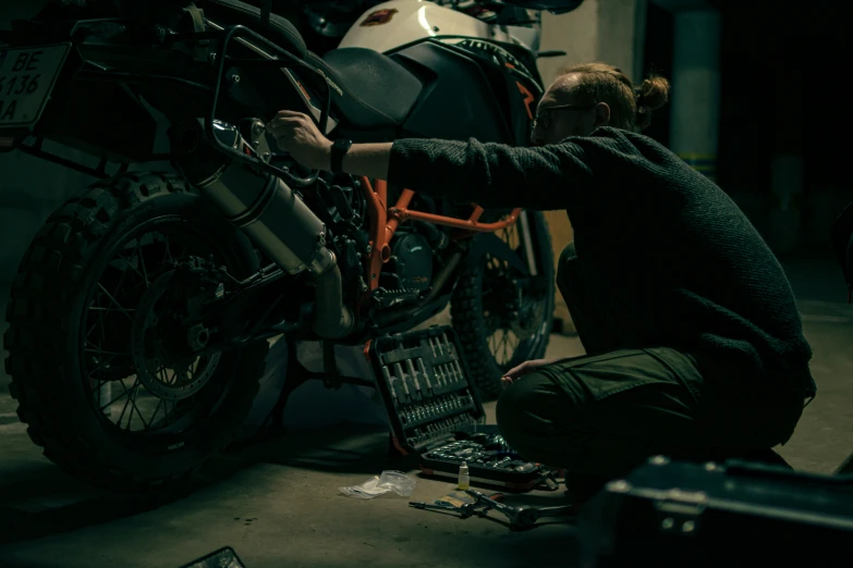 a woman putting together a new motorcycle chain