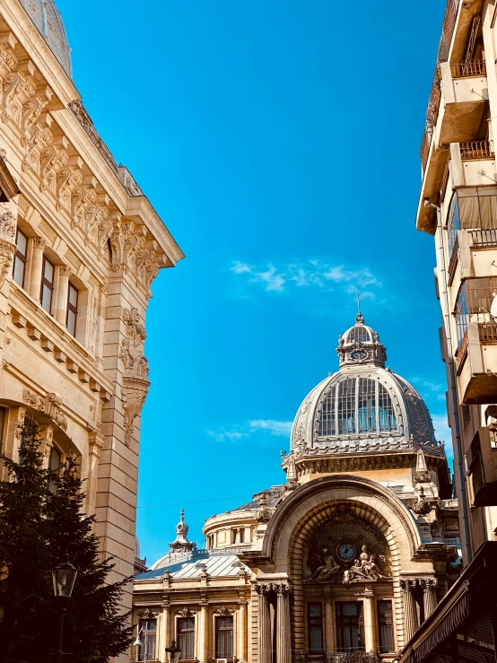 a couple of buildings in front of a blue sky