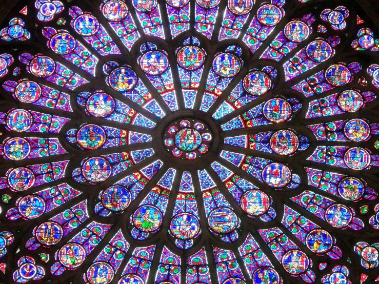 an ornate stained glass window inside a building