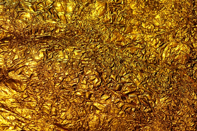 a bunch of gold leaves in the water