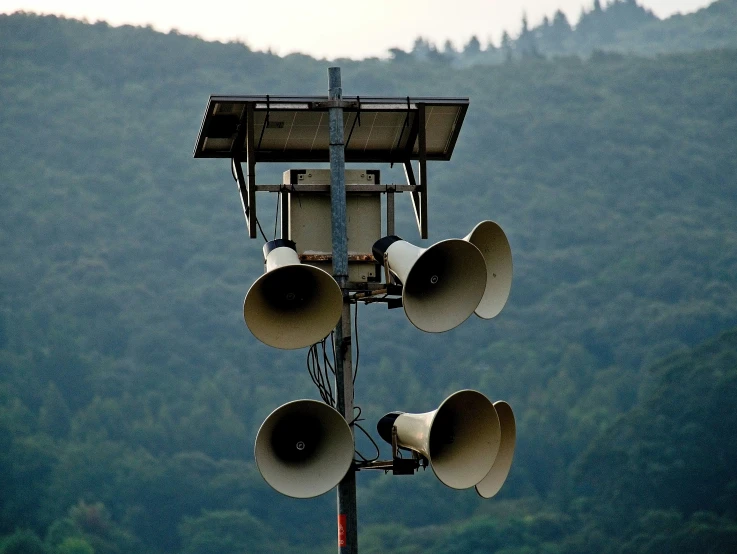 a group of six bells sitting next to each other