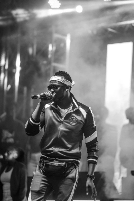 young black man singing into a microphone