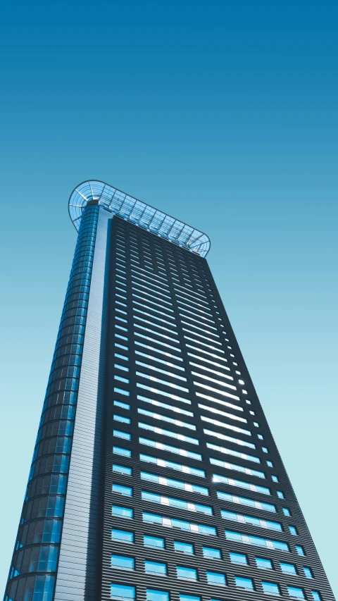 a tall skyscr building sits high in the sky