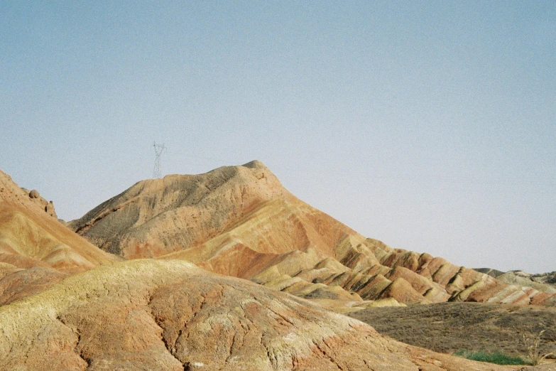 a bird flying in the sky over some mountains