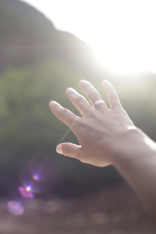 someone holds their hand in the air for the camera