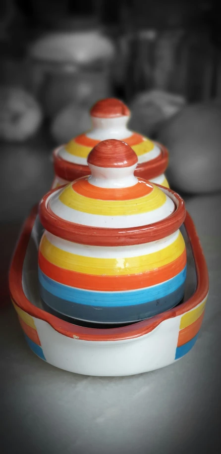 colorfully painted bowls are sitting on a table